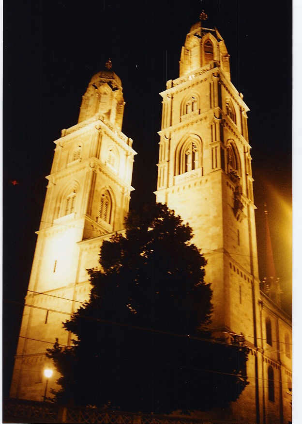 A church lit up at night

Description automatically generated